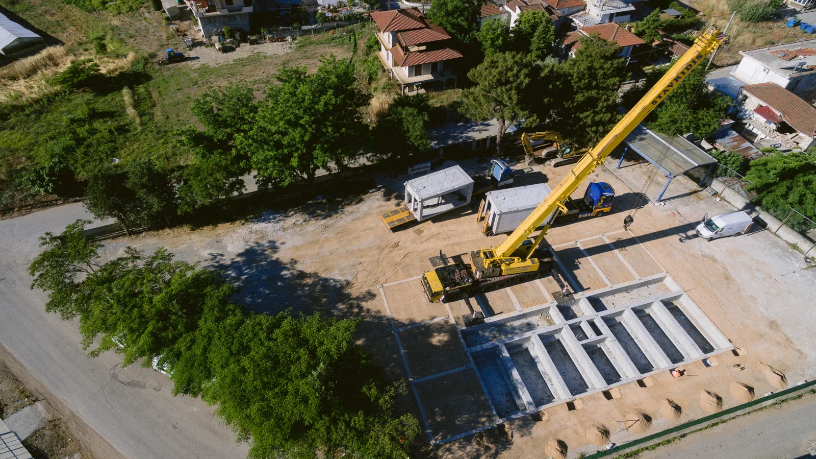 Construction photography — crane houses site — ORIA.FILMS